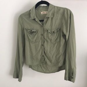 A navy green button down long sleeve shirt